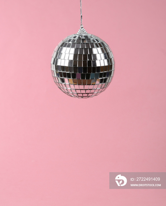 Disco ball on a pink background. Minimalism party concept