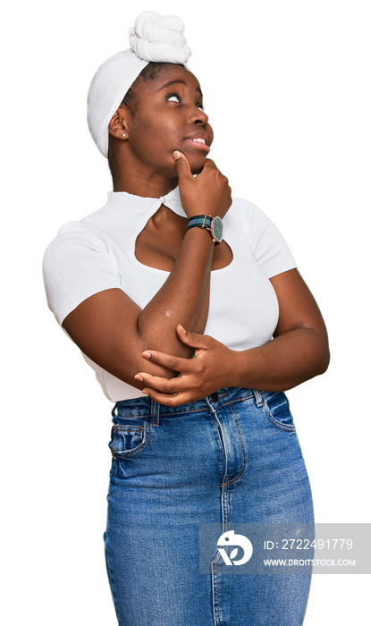 Young african woman with turban wearing hair turban over isolated background thinking worried about a question, concerned and nervous with hand on chin