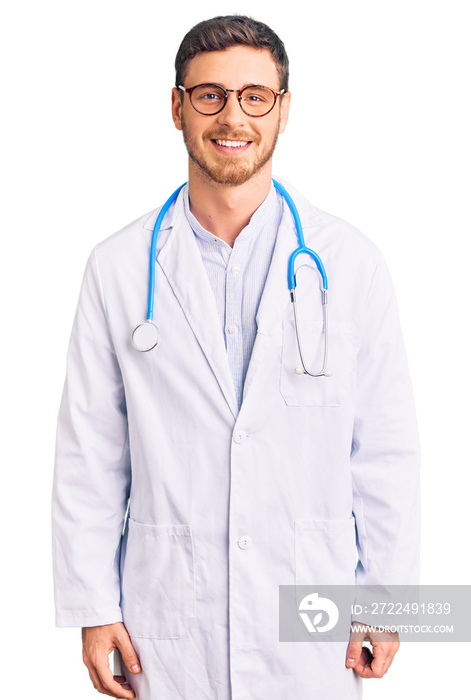 Handsome young man with bear wearing doctor uniform with a happy and cool smile on face. lucky person.