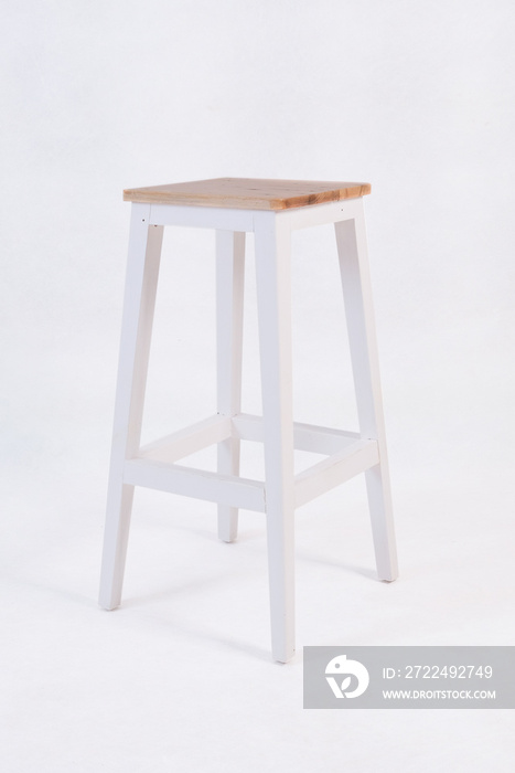 white cafe chairs and natural wood top with a white background