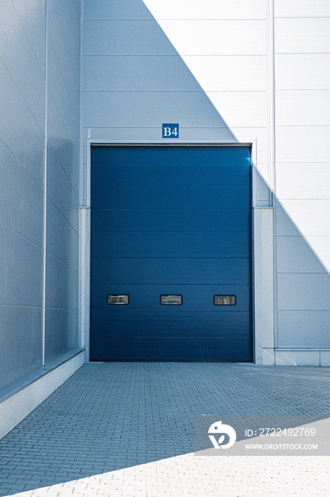 Blue entrance gate to the warehouse