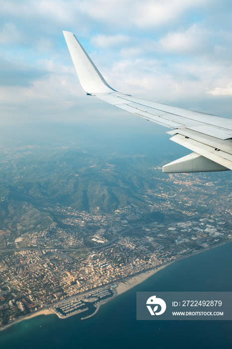 Barcelona city and harbour skyline seen from an airplane