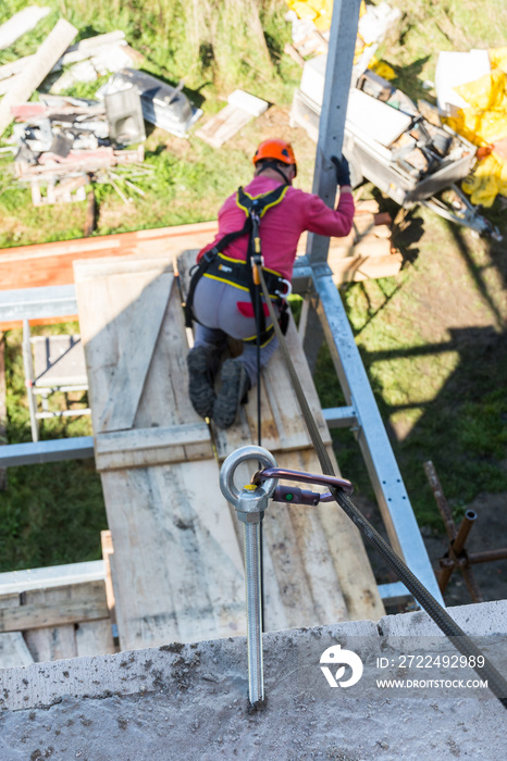 Height works on construction. Close-up of anchor eye. Occupational safety. Protection of a worker while working on building a loggia.