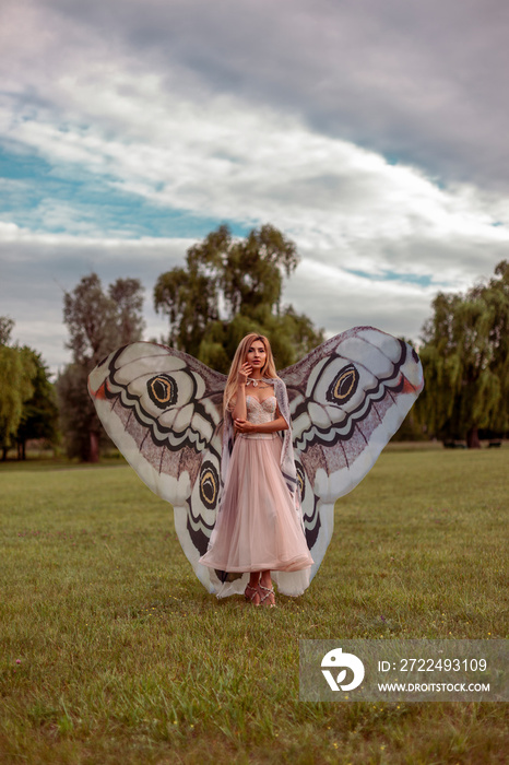 Beautiful woman with big butterfly wings