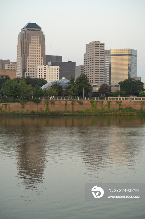 The Red River meanders by under bridges and by the waterfront in Shreveport Louisiana