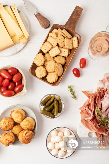 Appetizers table with different antipasti, charcuterie, snacks, cheese. Finger food for buffet party. Traditional french or italian entires. Top view