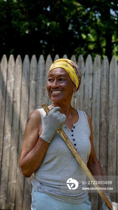 Senior woman working in backyard