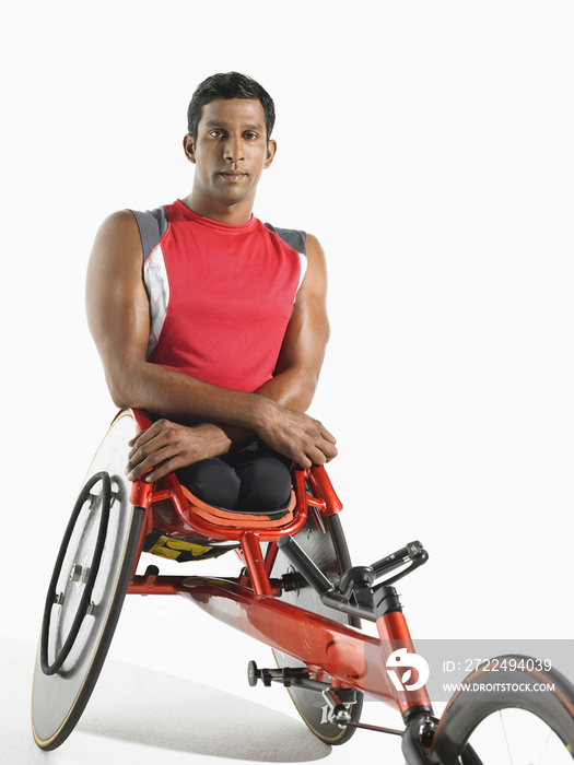 Portrait of a paraplegic cycler against white background