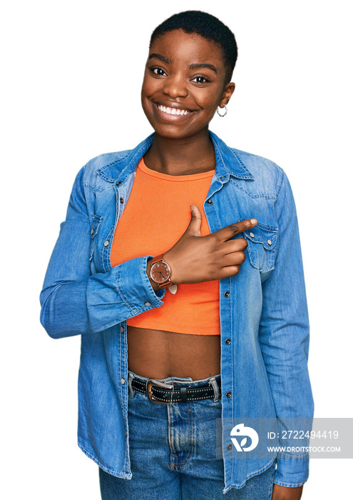 Young african american woman wearing casual clothes cheerful with a smile on face pointing with hand and finger up to the side with happy and natural expression