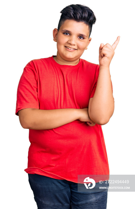 Little boy kid wearing casual clothes smiling happy pointing with hand and finger to the side