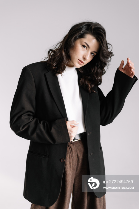 Fashion photo of young magnificent woman on white background. Girl posing. Studio photo.