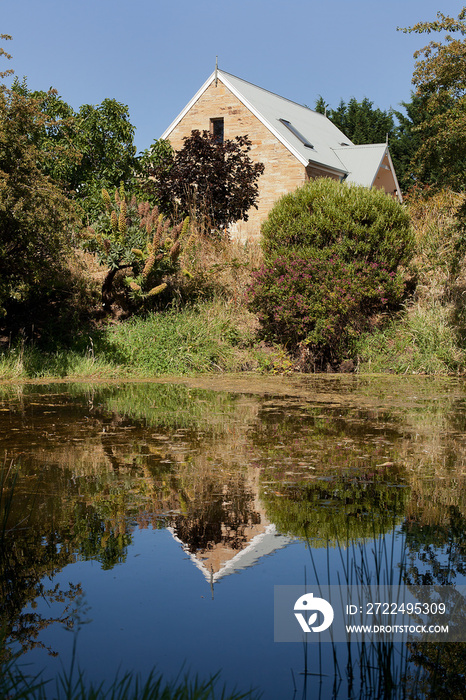 Exterior view of an old brick barn building renovated and converted to accommodation