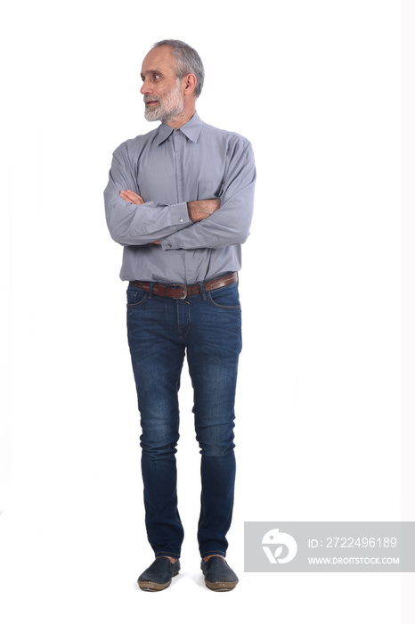 middle-aged man with blue jeans and shirt  crossed arms on white background