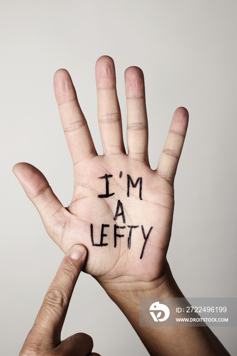 text I am a lefty in the palm of the hand