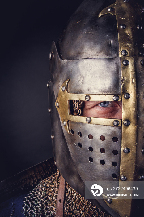 A man in a knight helmet.