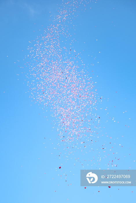 red confetti in the blue sky