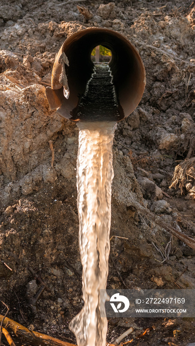 Waste water flows from the pipe,pollution of nature and the environment,industrial mud.