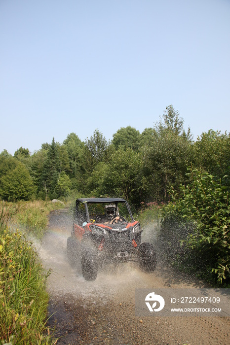 Sxs crusin through water on trails in VT