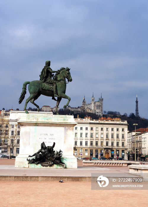 Lyon Main square with Statue of Louis and Basilique Fourviere on a background, France