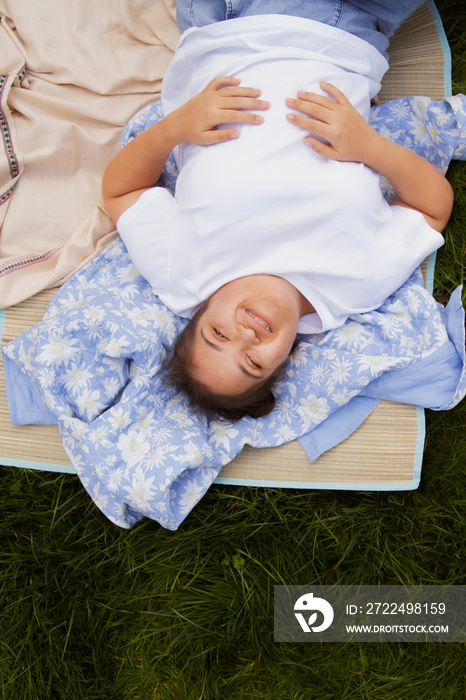 Curvy girl with Down syndrome relaxing in the park