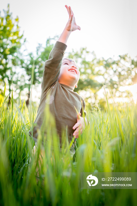 Happy baby boy on summer vacation having fun and happy time