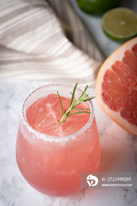 paloma cocktail with grapefruite on marble background