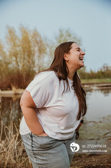 portrait of a plus size woman laughing