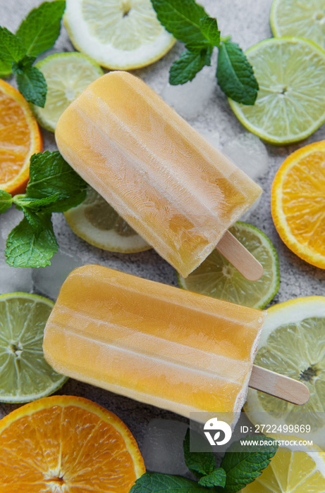 Natural juicy orange popsicles.