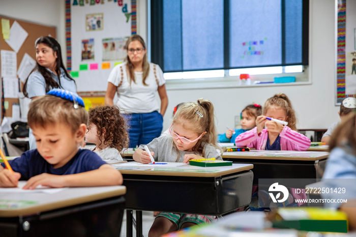 Children drawing in classroom