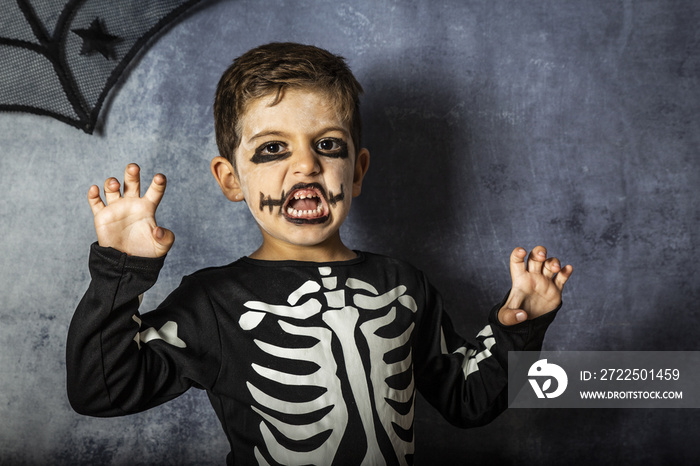 Little kid in a skeleton costume on Halloween Carnival