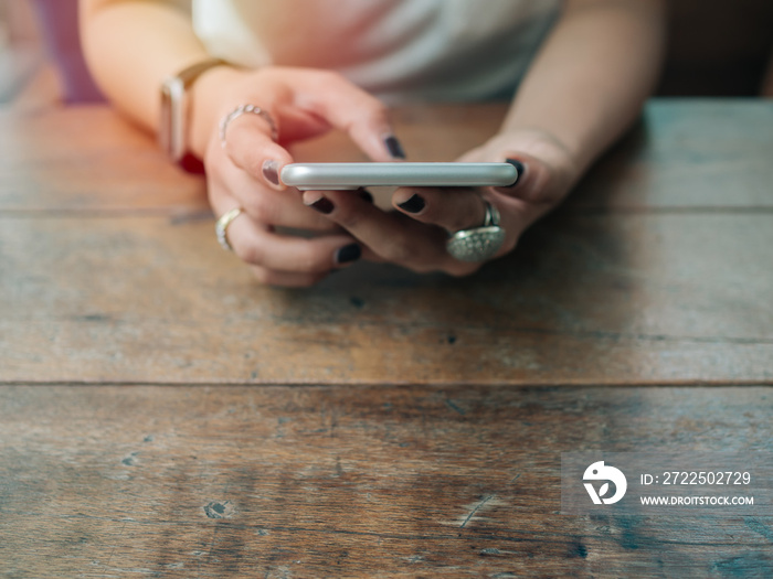 Women hands using smartphone.