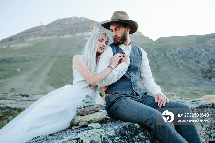 Wedding couple getting married in the mountains in Switzerland