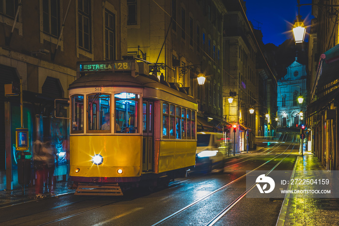 tram on line 28 in lisbon, portugal at night