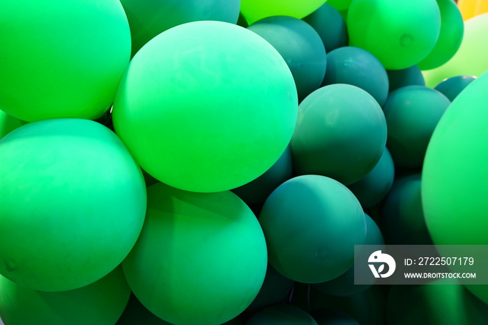 Colorful green and multicolor balloons at a party