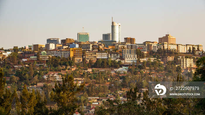 Kigali downtown with modern buildings and huts