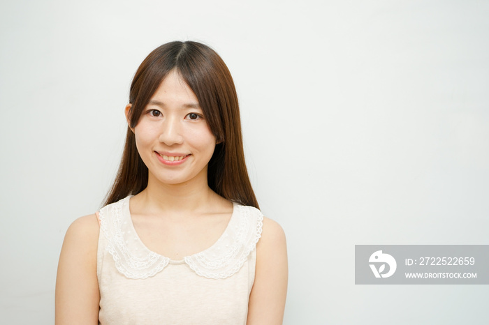 Young woman on the white background