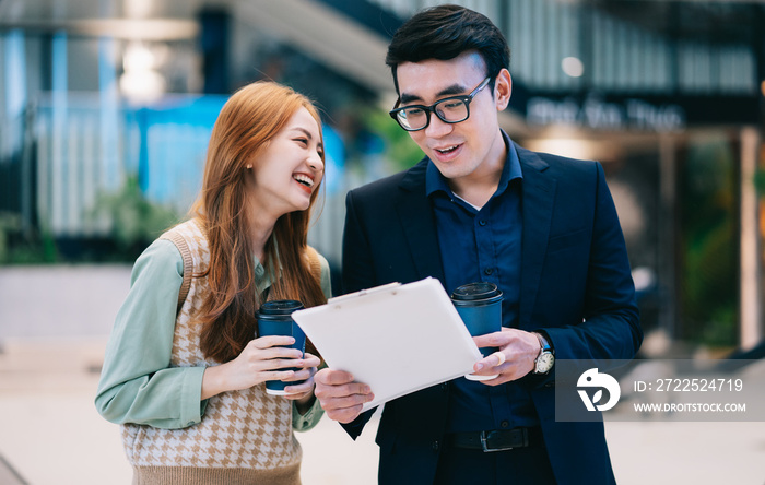 Portrait of young Asian business people at office