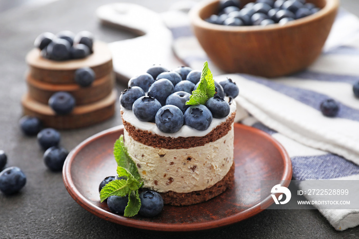 Tasty blueberry cake on grey table