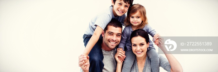 Parents giving children piggyback rides