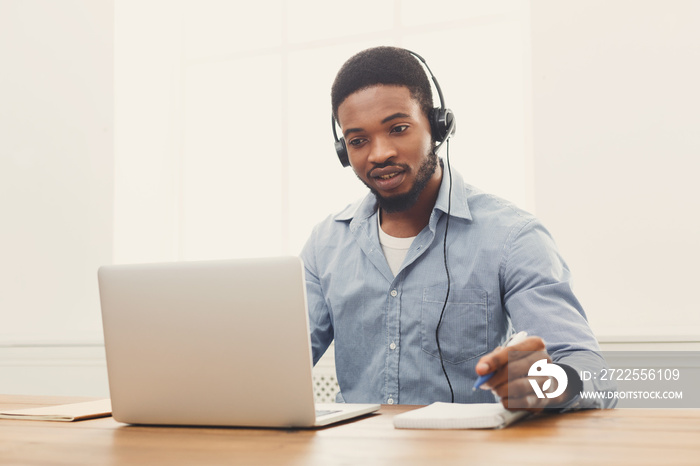 Call center operator man with headset working