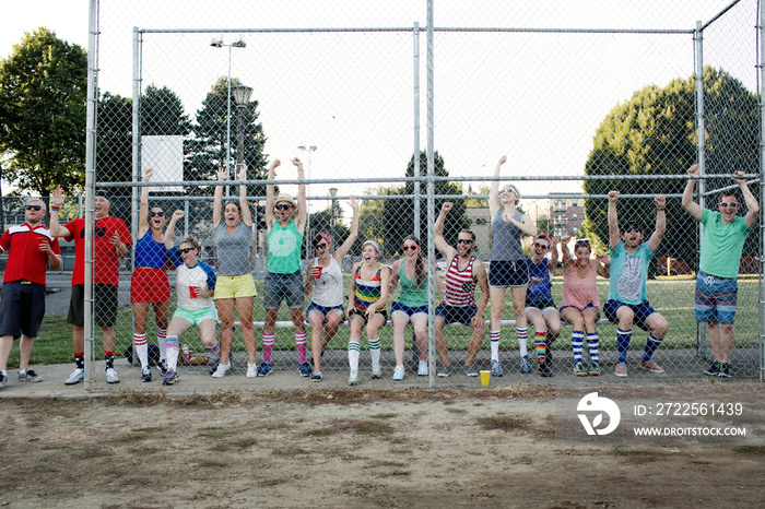 Group of friends watching baseball game outdoors