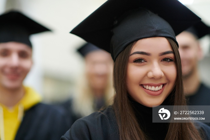 Group of diverse international graduating students celebrating