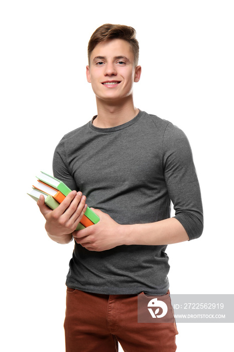 Young teenager boy with books on white background