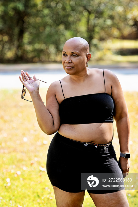 Bald Black woman outside