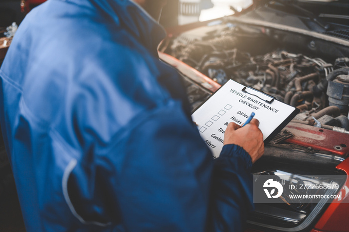 Car mechanic inspecting vehicle.  Auto inspection concept