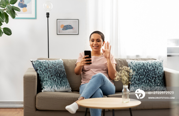 technology and people concept - happy smiling african american woman with smartphone having video ca