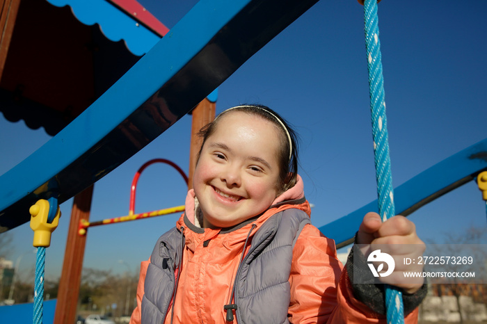 Portrait of beautiful girl on the playground