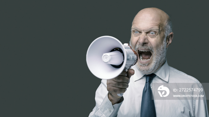 Aggressive boss shouting on a megaphone