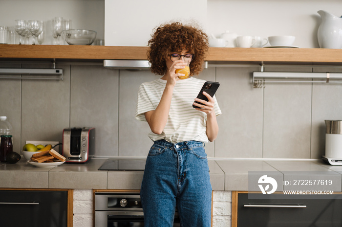 Smiling young woman on the phone