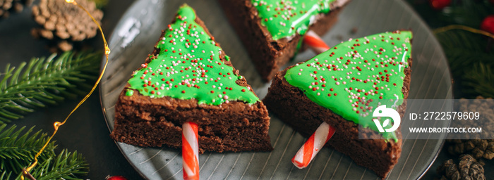 Green christmas sweet tree made from chocolate brownie. Cute idea for kids for christmas dessert